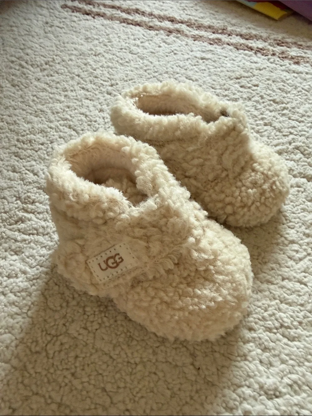 UGG Baby Sherpa Slip-On Slippers in Cream